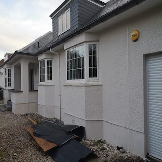 House roughcasted in white chip  Newton Mearns. Glasgow